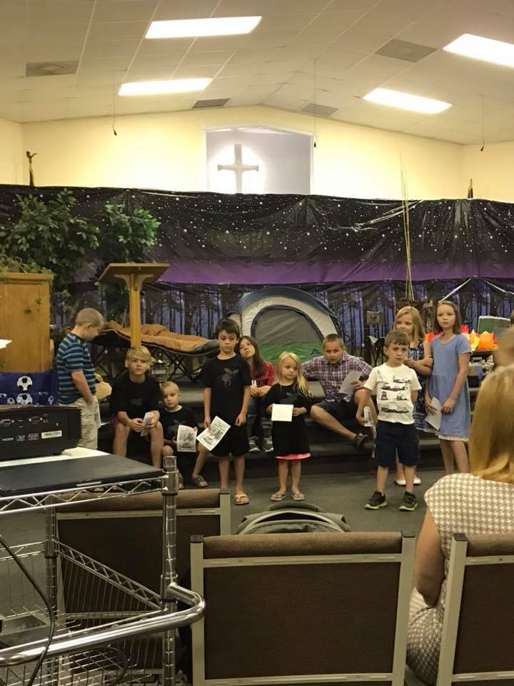 Children performing on stage during Vacation Bible School